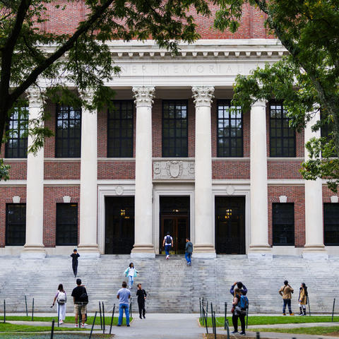 The front entrance to Widener Library at Harvard University. A brick building with large columns and starecase.