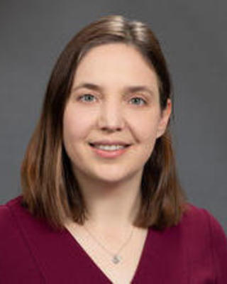 Headshot of Emily Breza.